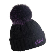Linda black cable knit bobble hat with purple Sabbot script and purple faux fur pom pom, by Sabbot