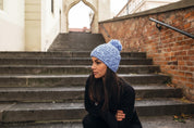 Sabbot Headwear Woman wearing a marl knit Scotland bobble hat Sabbot Headwear
