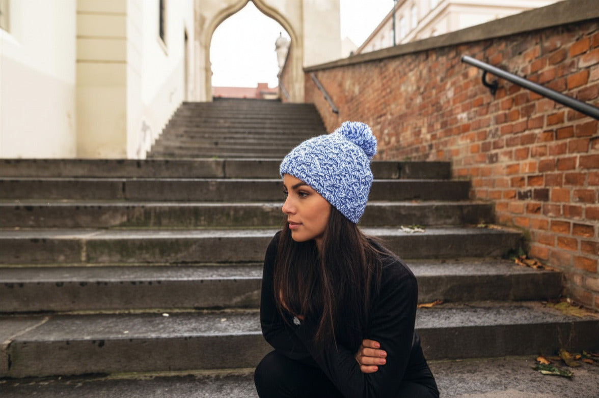 Sabbot Headwear Woman wearing a marl knit Scotland bobble hat Sabbot Headwear