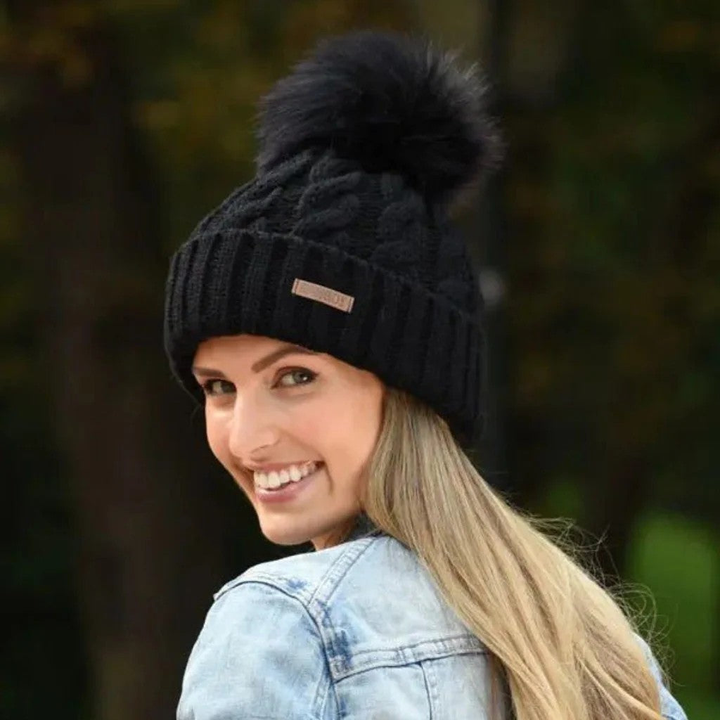 Linda women's cable knit bobble hat with faux fur pom pom, by Sabbot