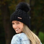 Linda women's cable knit bobble hat with faux fur pom pom, by Sabbot