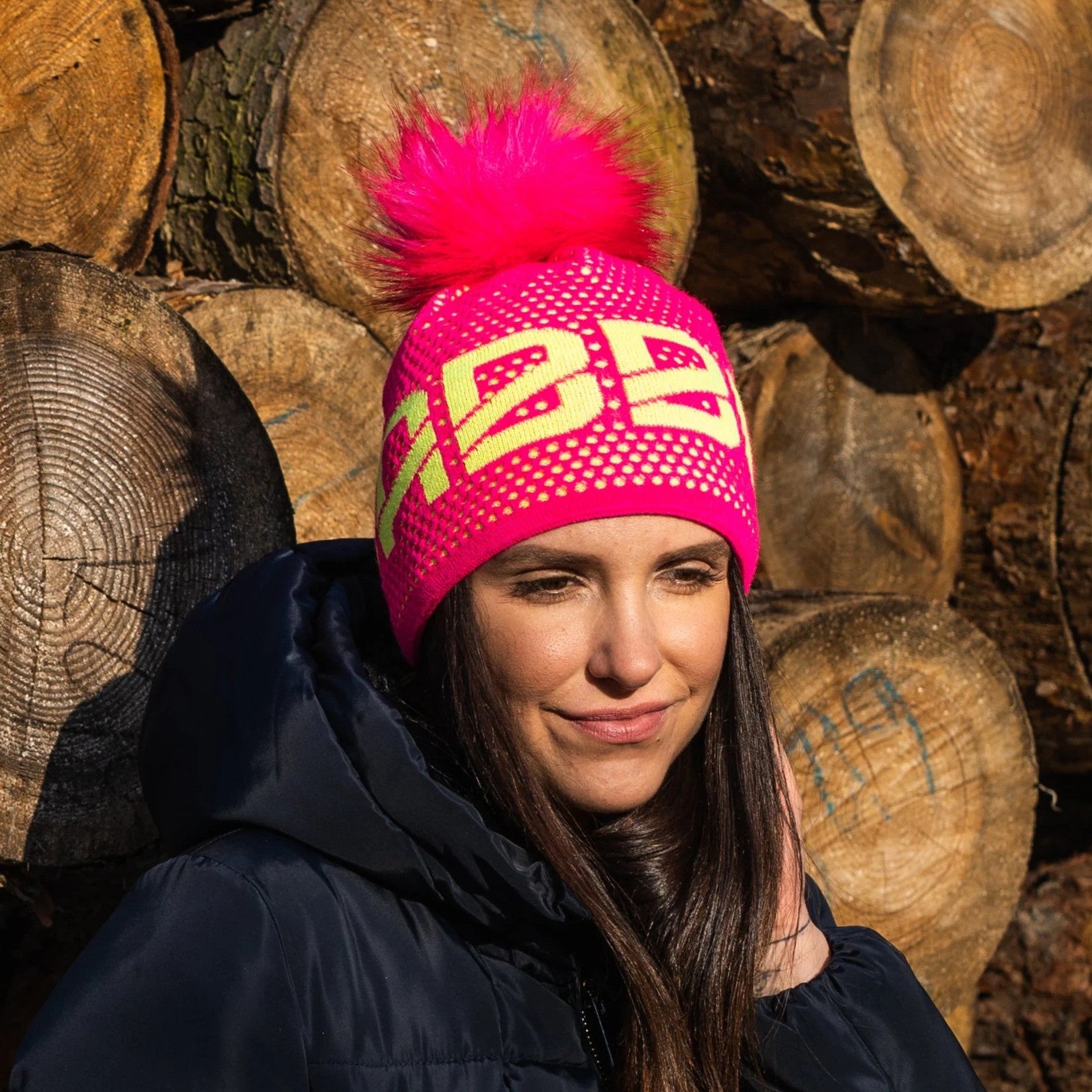 SABBOT neon logo bobble hat with black faux fur pom pom, by Sabbot
