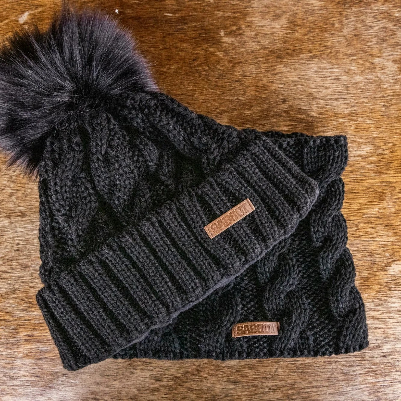 SABBOT Linda cable knit bobble hat and matching snood gift set in Black