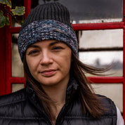 Two women by a red phone box wearing the Morgan Beanie in Black Camo