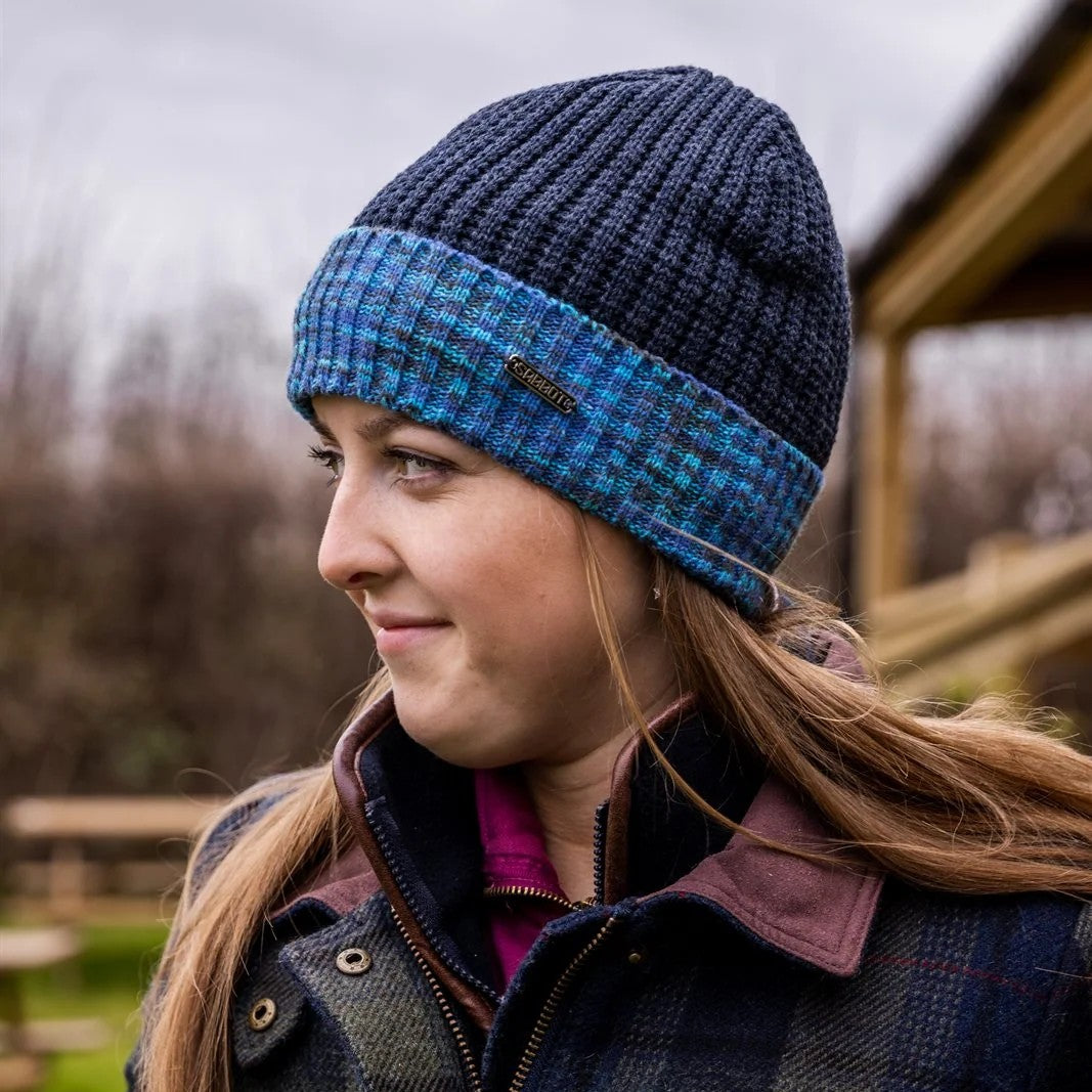 Two women in marl-cuff beanies on cabin steps wearing the Morgan Beanie in Blue Camo